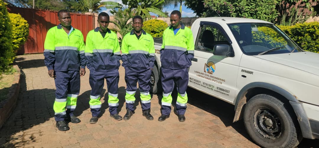 Lawnlink field testing team beside their service vehicle